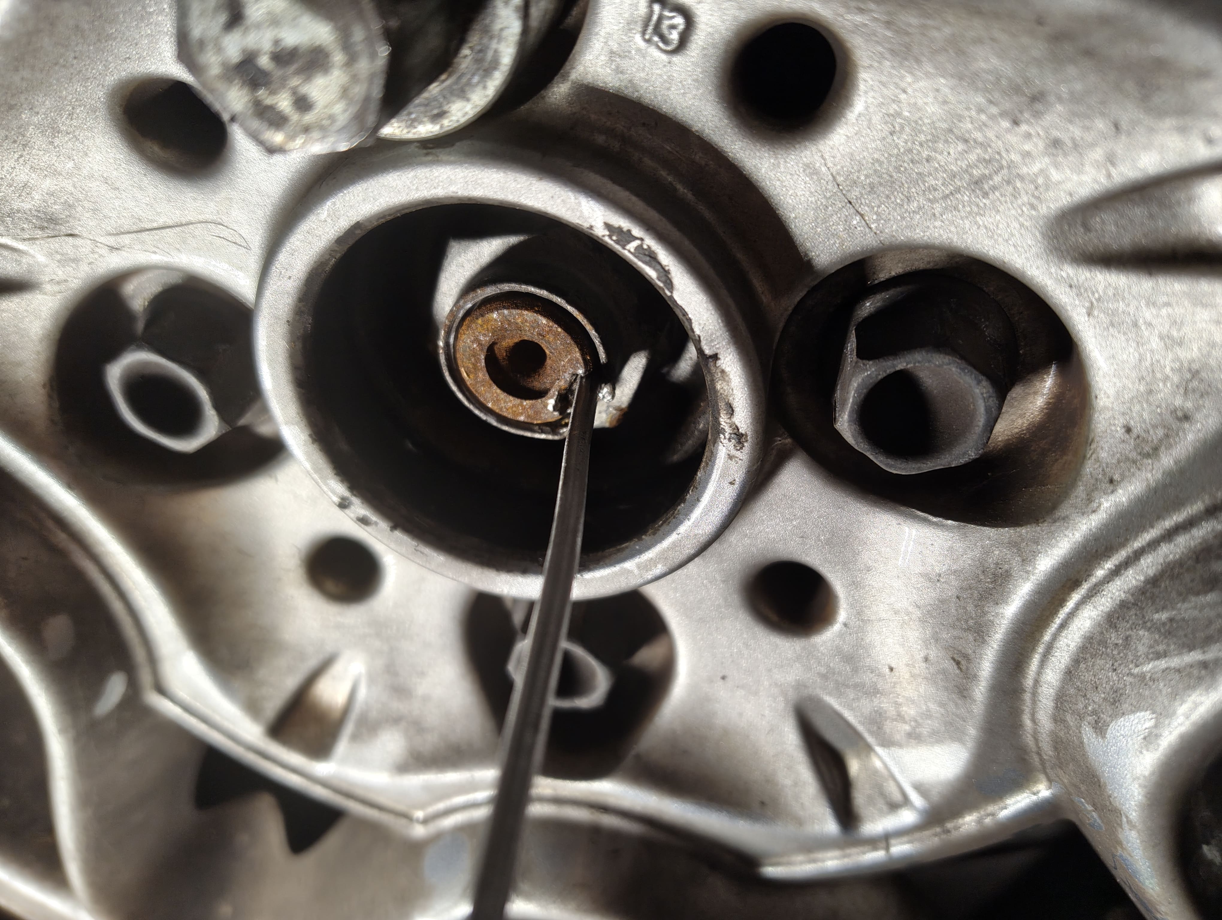 Before hammering the driveshaft nut indentation with a hammer and flathead screwdriver