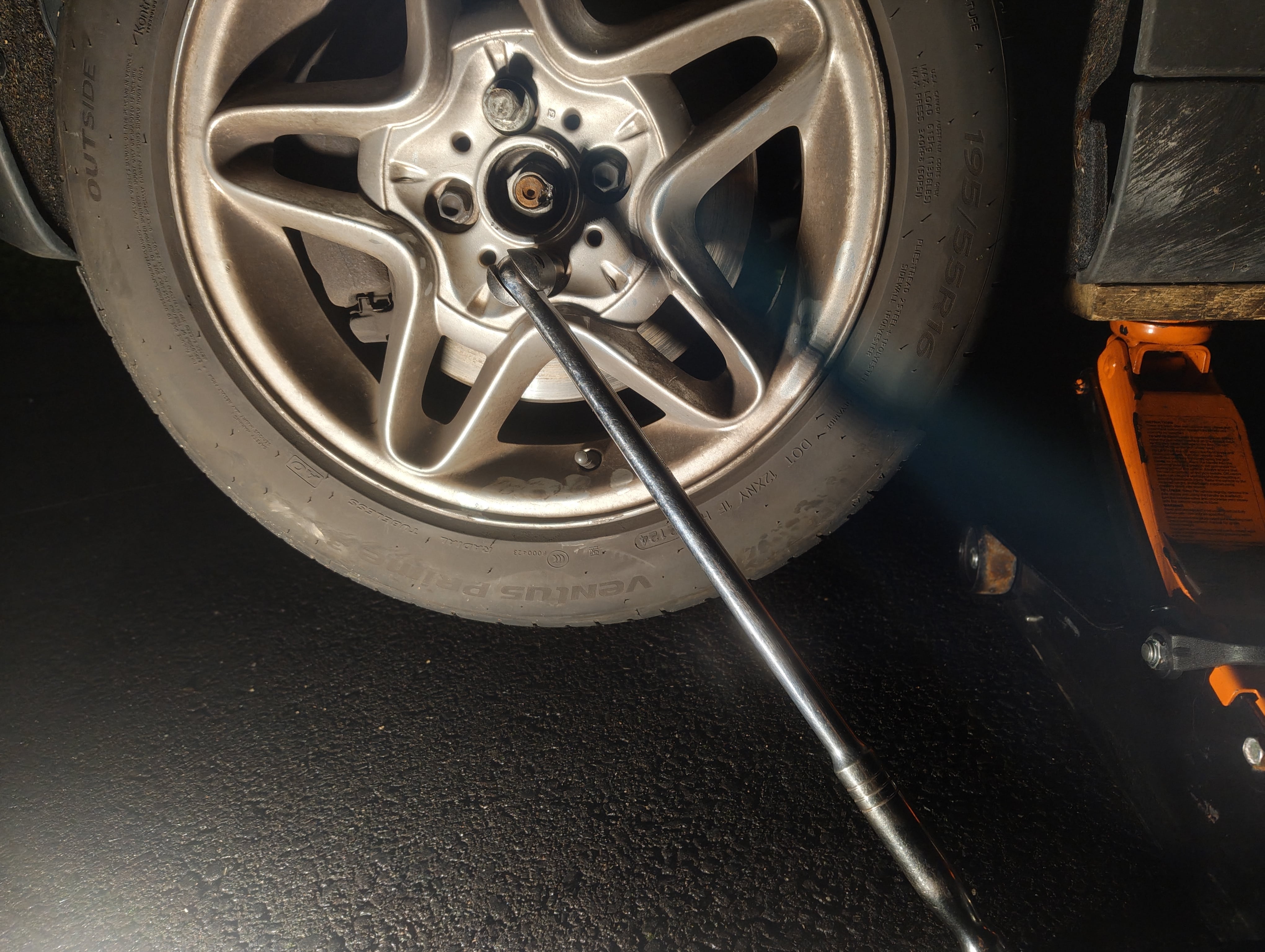 Removing the front passenger-side lug nuts